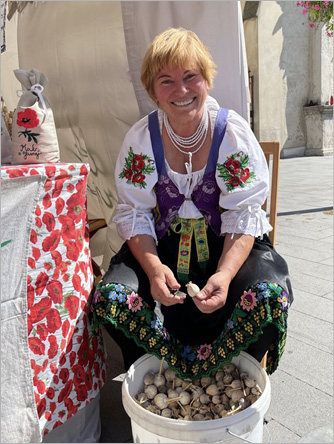 Photograph of woman extracting poppy seed