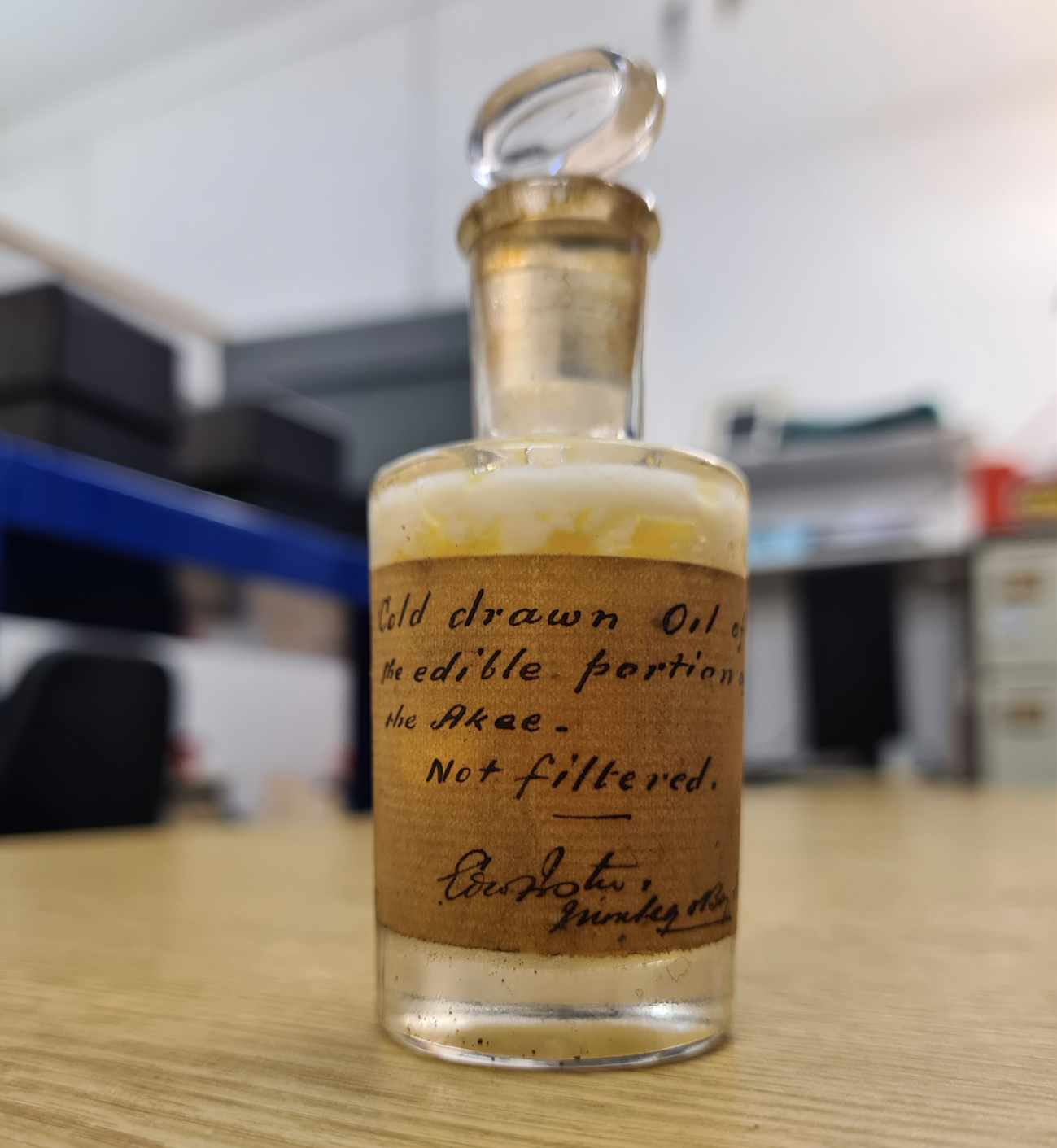 an old bottle containing ackee oil