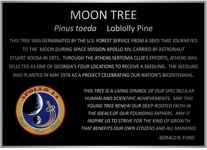 Image of a sign containing silver text on a black background